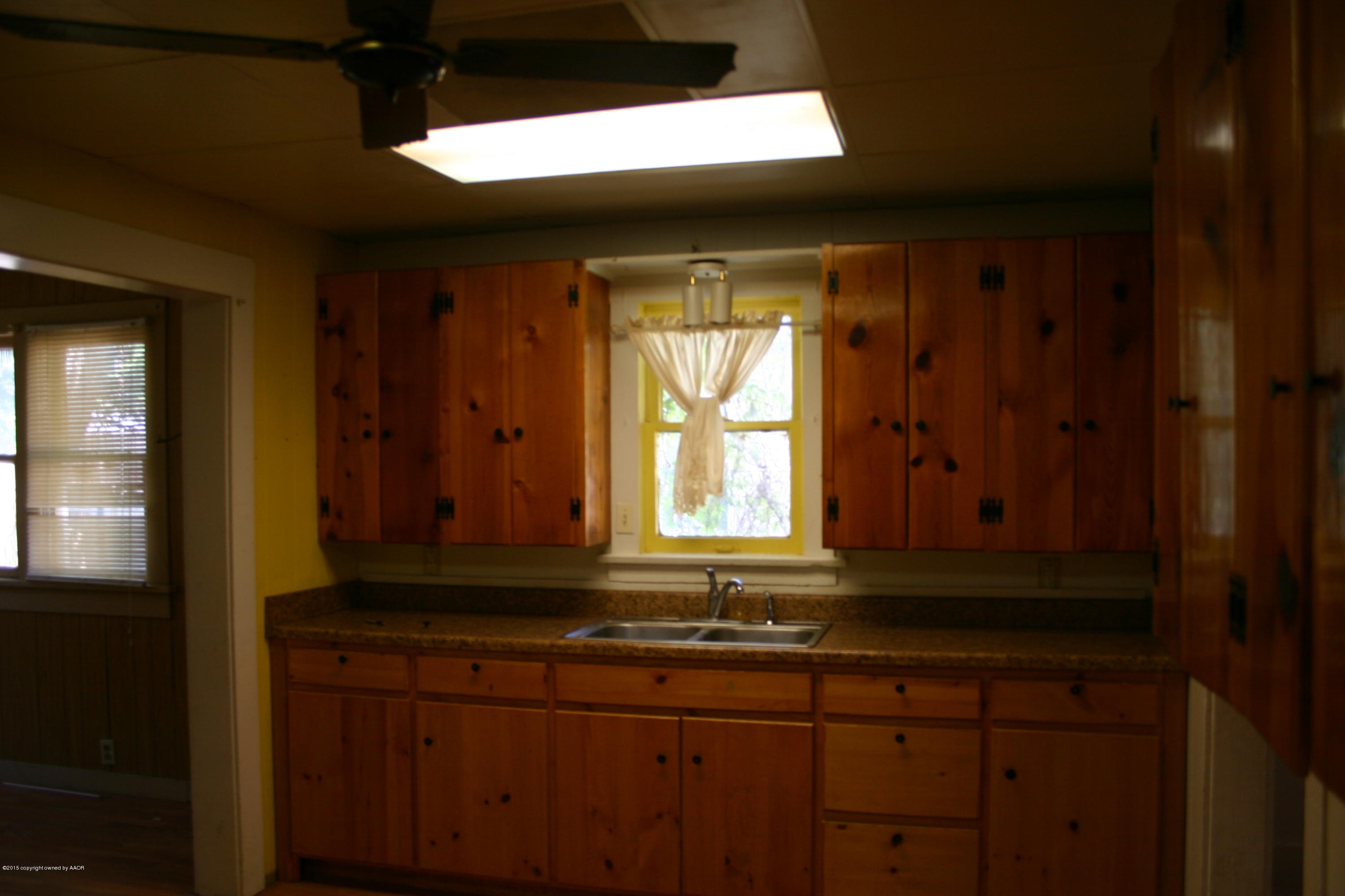 2214 South Taylor Street Amarillo, TX 79109 - Photo 13 of 30 a bathroom with a sink and a mirror