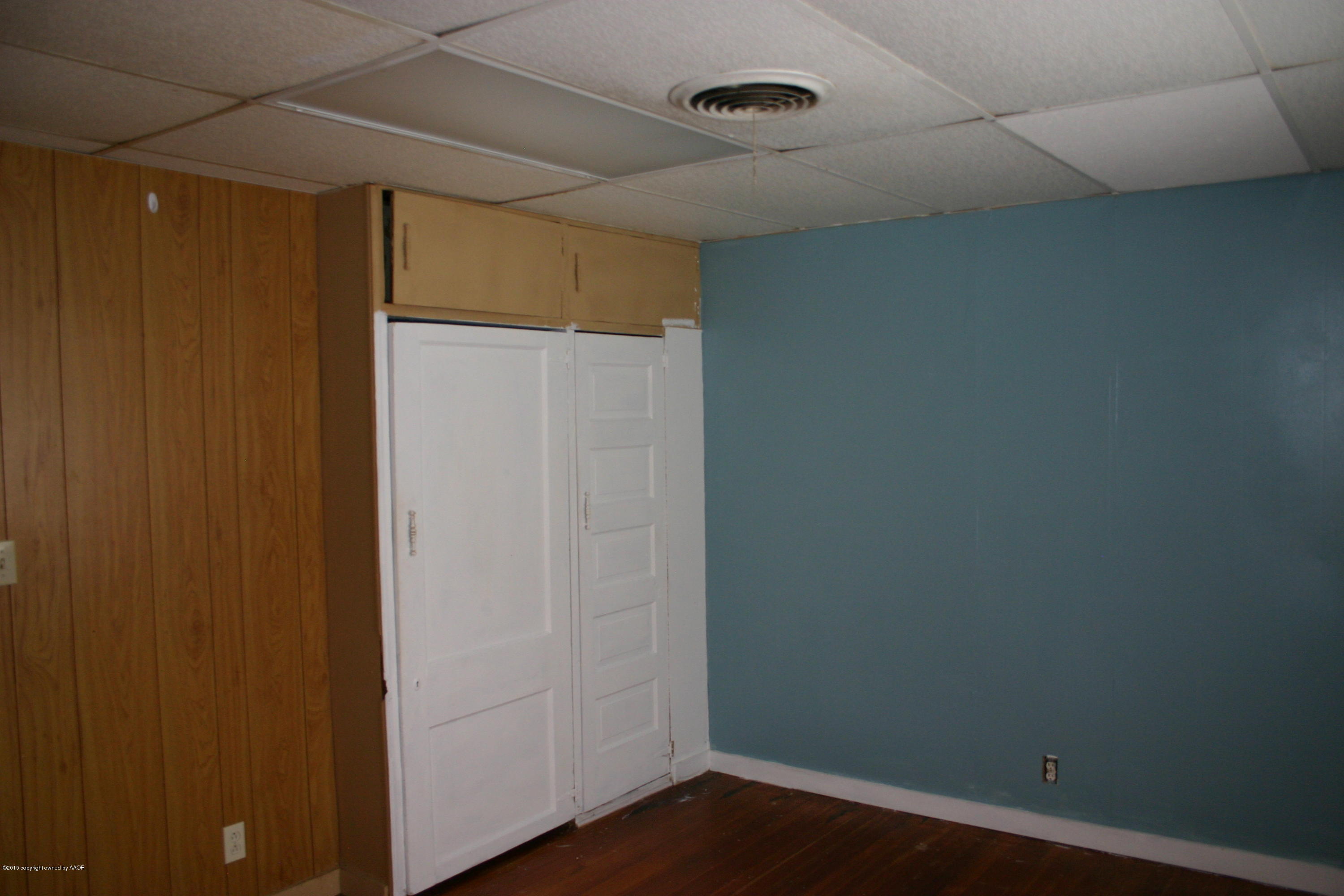 2214 South Taylor Street Amarillo, TX 79109 - Photo 25 of 30 a view of an empty room with wooden floor
