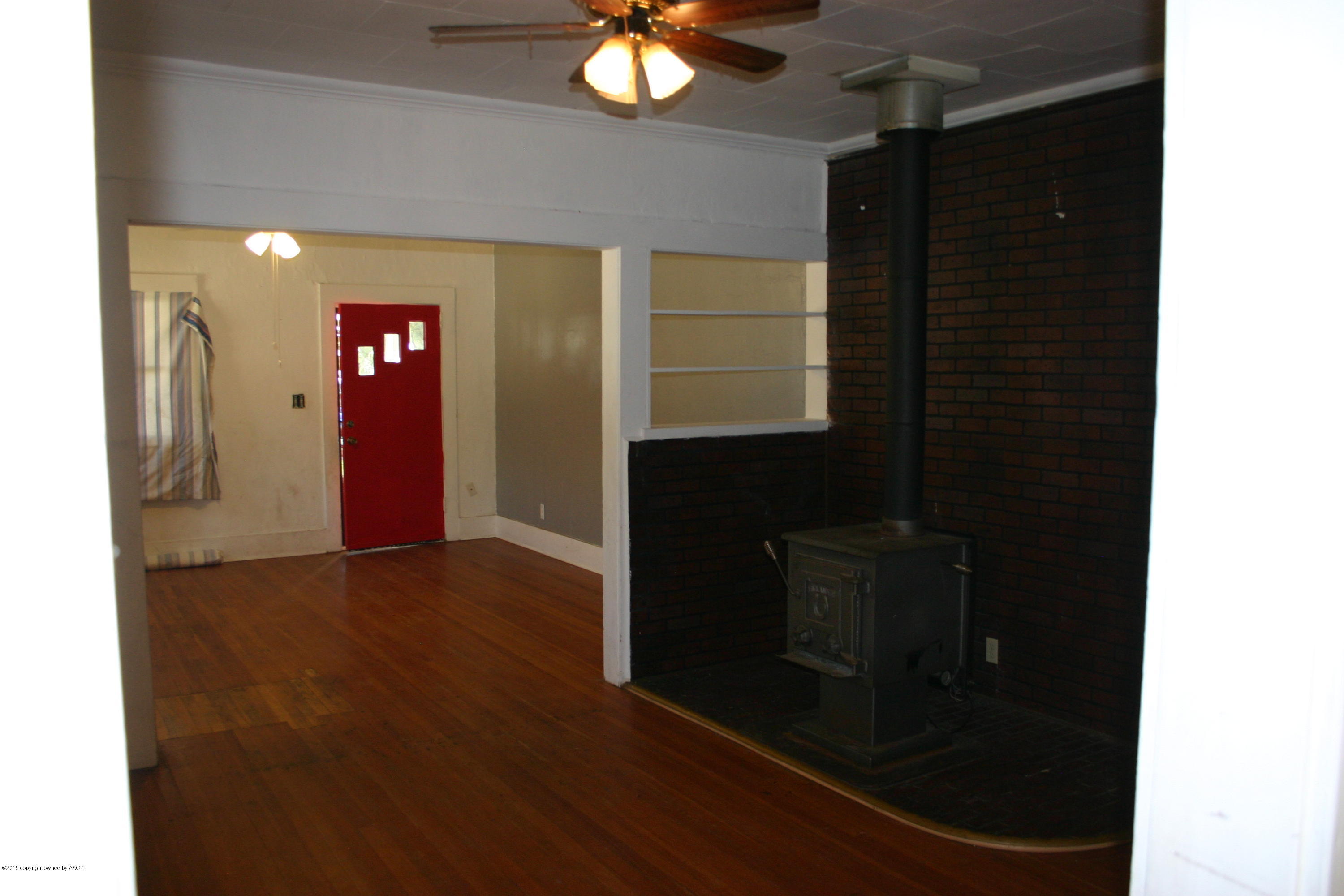 2214 South Taylor Street Amarillo, TX 79109 - Photo 10 of 30 a view of a hallway with wooden floor