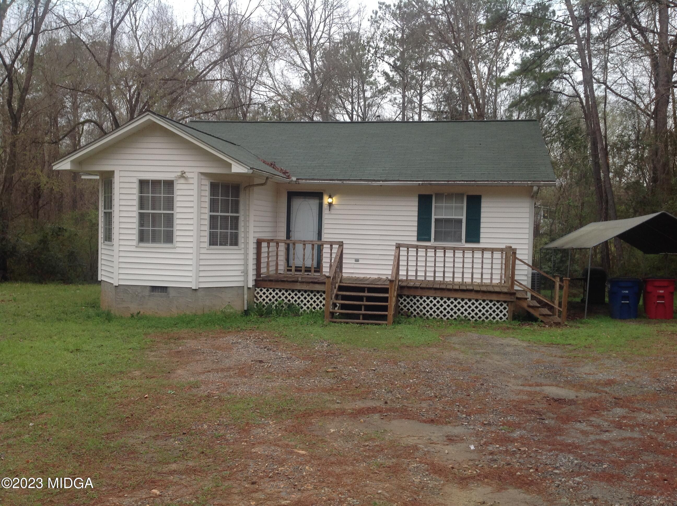 6251 Columbus Road Macon, GA 31206 - Photo 1 of 33 a view of a house with a yard