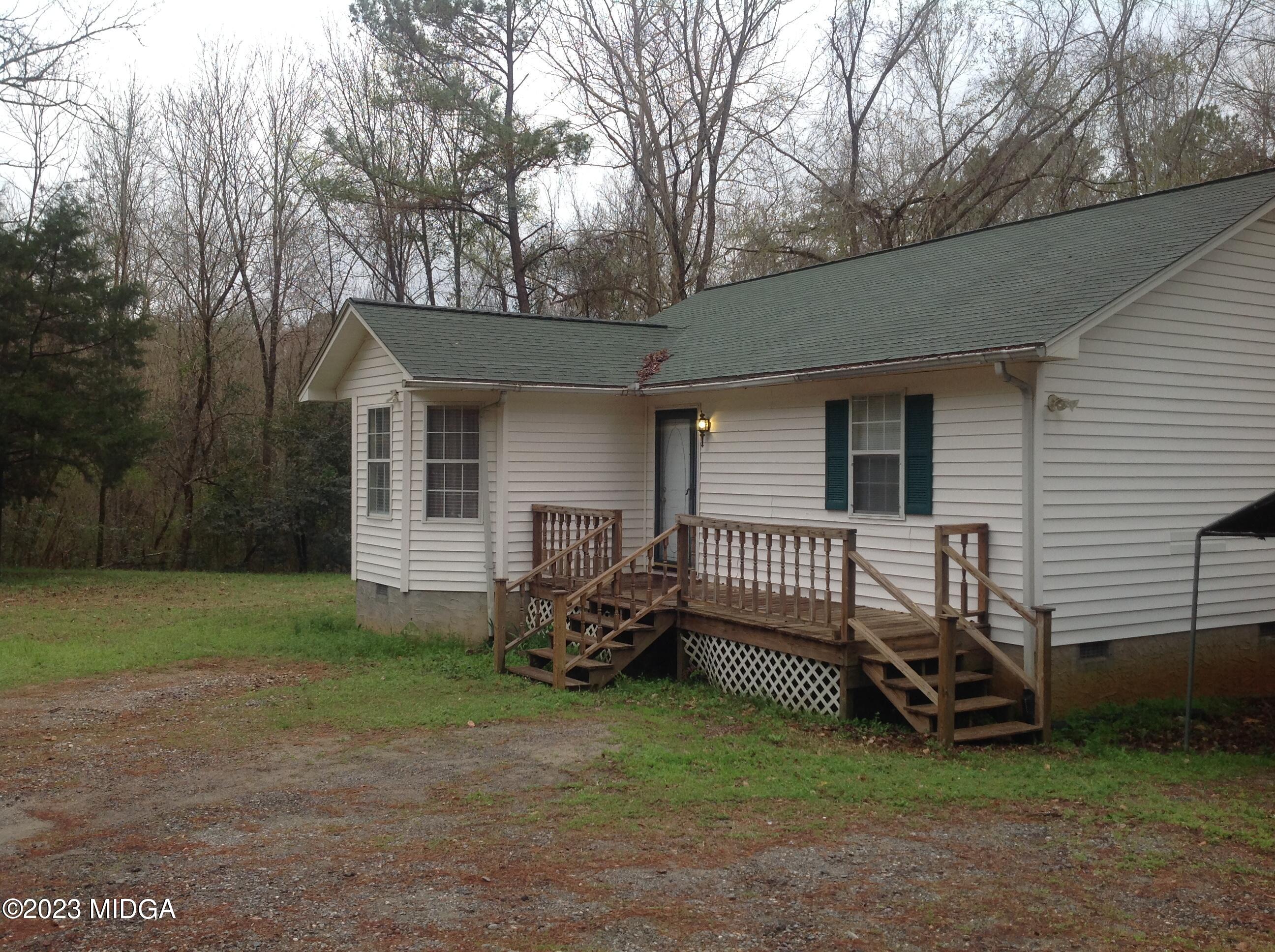 6251 Columbus Road Macon, GA 31206 - Photo 2 of 33 a view of a house with a yard