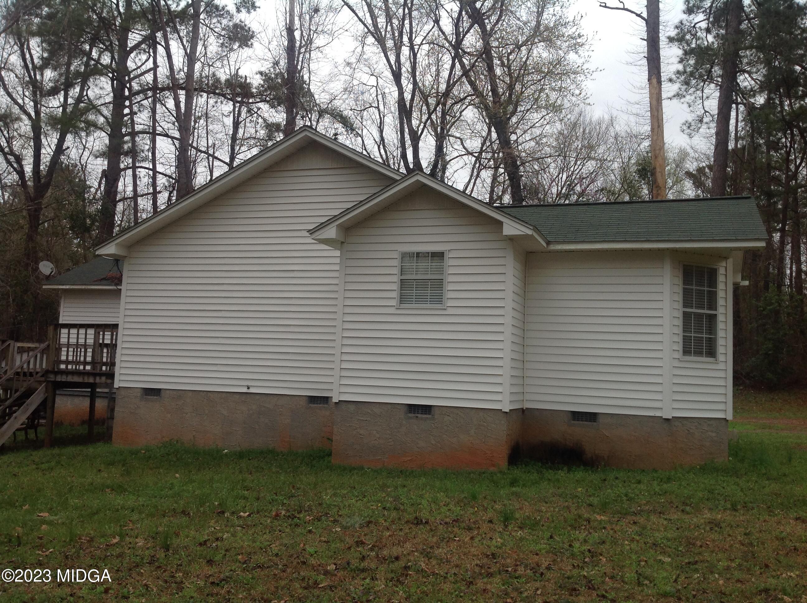 6251 Columbus Road Macon, GA 31206 - Photo 26 of 33 a front view of a house with a yard
