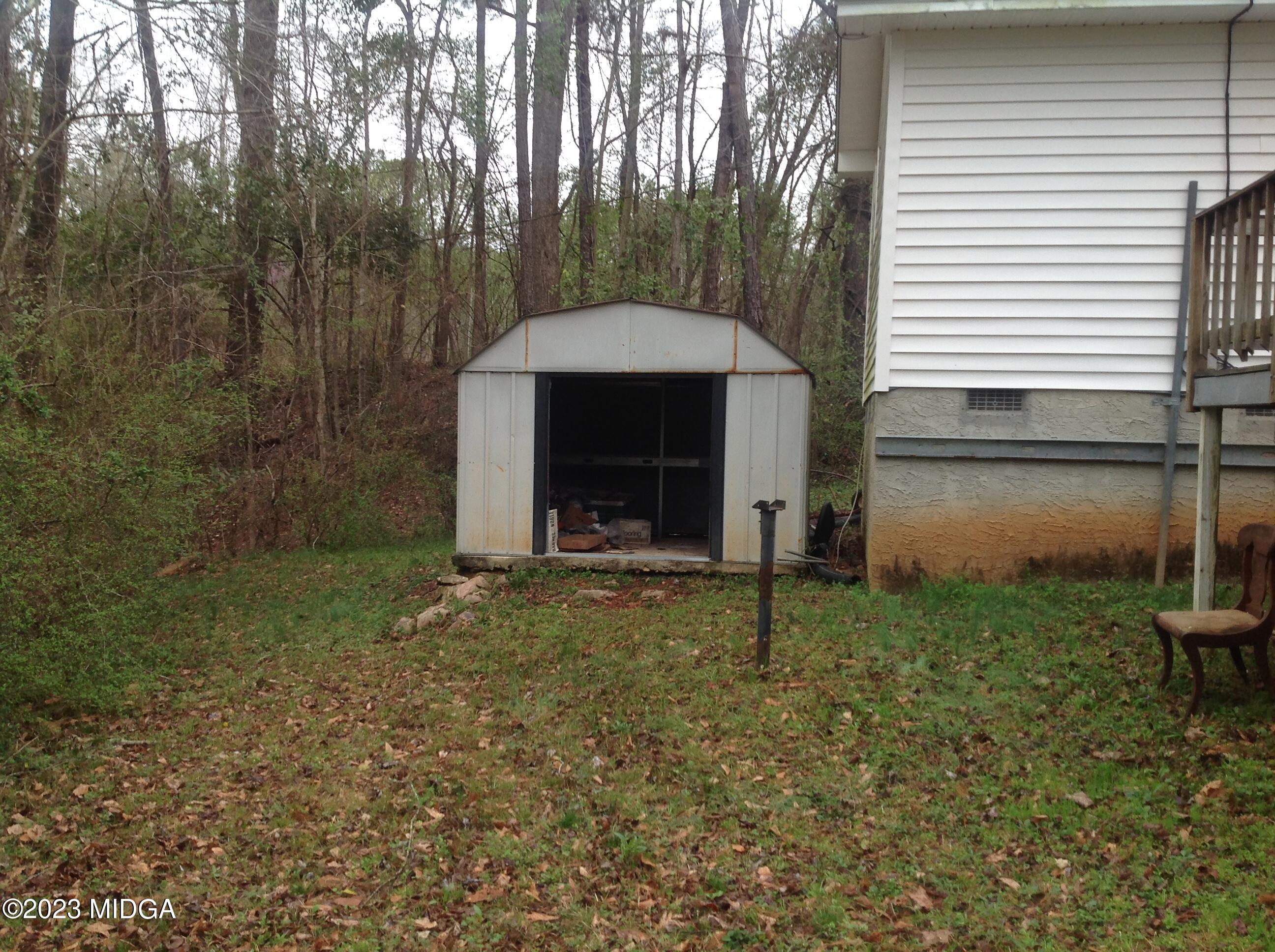 6251 Columbus Road Macon, GA 31206 - Photo 28 of 33 a view of a house with backyard and garden