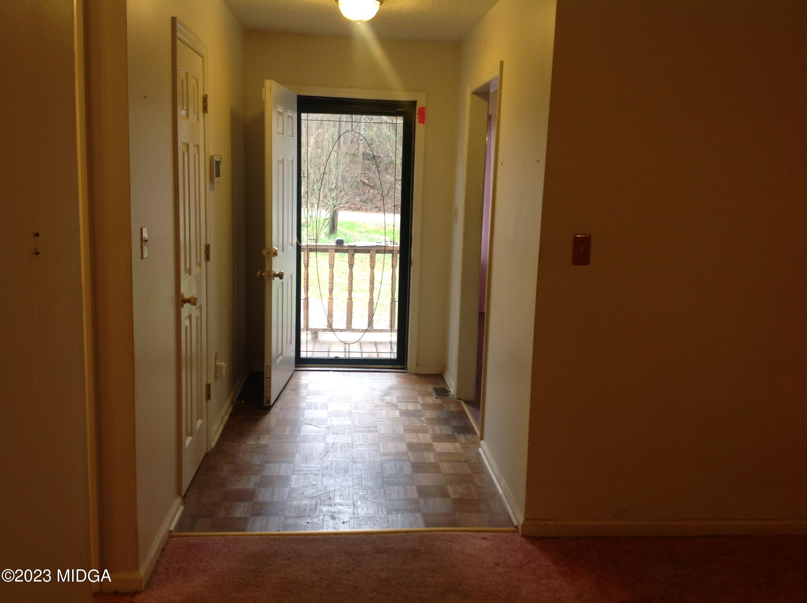 6251 Columbus Road Macon, GA 31206 - Photo 6 of 33 a view of a hallway with a wooden floor
