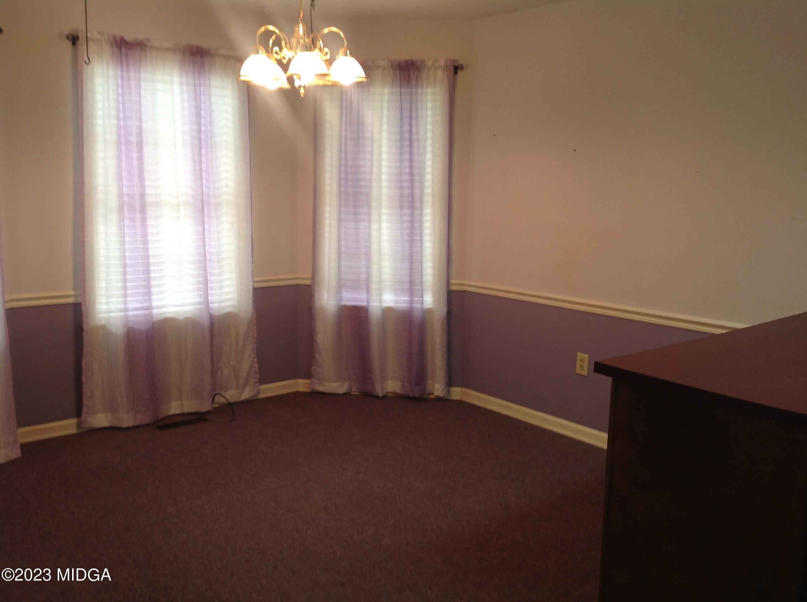 6251 Columbus Road Macon, GA 31206 - Photo 10 of 33 wooden floor in an empty room with a window