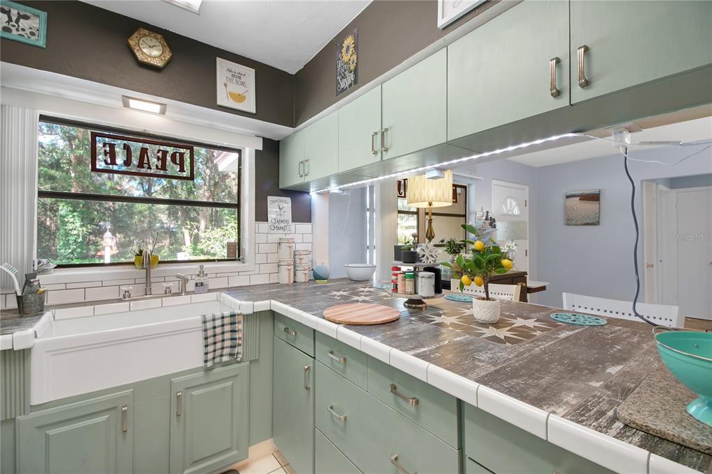 6122 East Glencoe Street Inverness, FL 34452 - Photo 17 of 37 a kitchen with a sink and cabinets
