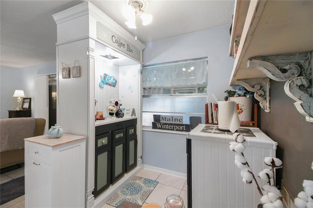 6122 East Glencoe Street Inverness, FL 34452 - Photo 19 of 37 a kitchen with a sink stove and refrigerator