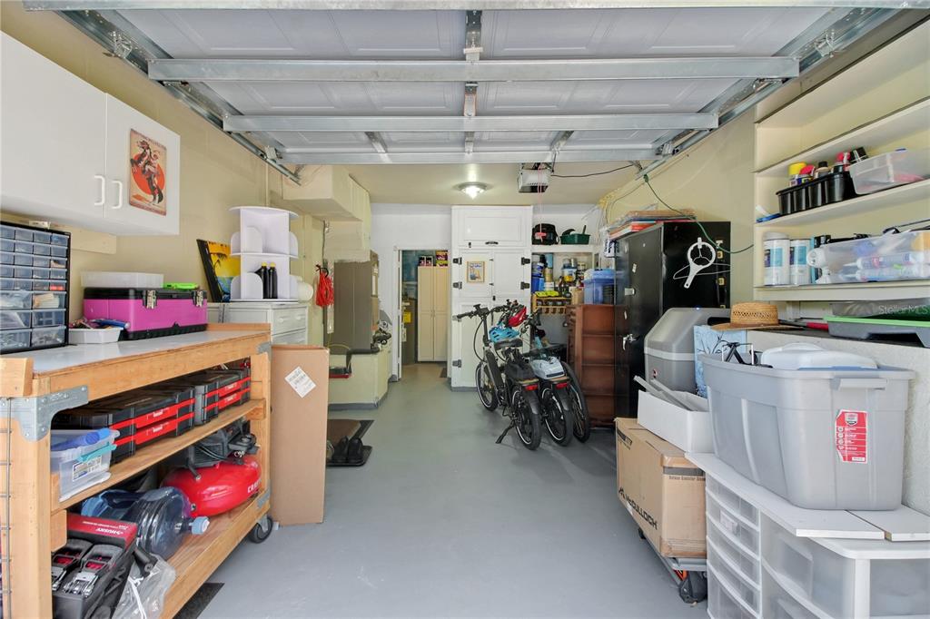6122 East Glencoe Street Inverness, FL 34452 - Photo 20 of 37 a storage room with washer and a ceiling fan