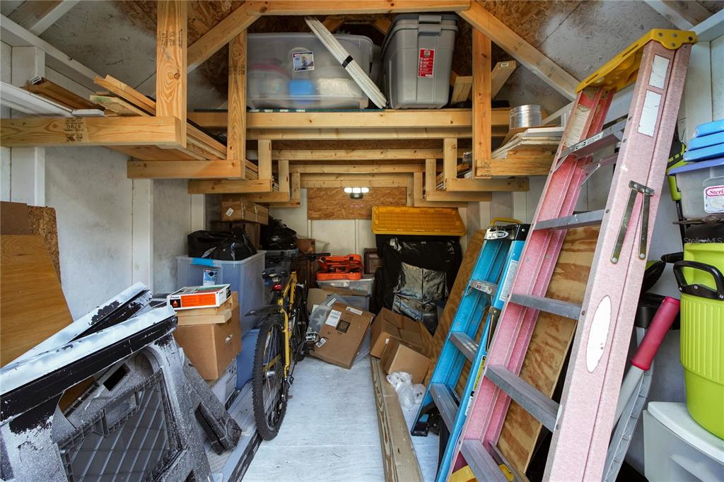 6122 East Glencoe Street Inverness, FL 34452 - Photo 32 of 37 a view of walk in closet with clothes and shoes
