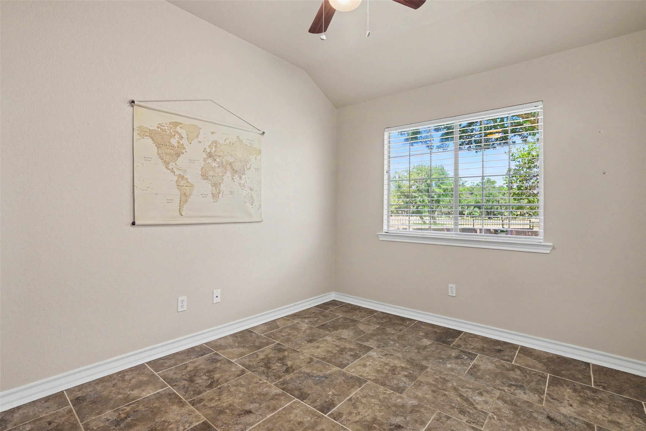 30107 Hamlet Circle Georgetown, TX 78628 - Photo 21 of 40 A quiet office space offers tiled flooring and a serene view of the outdoors.