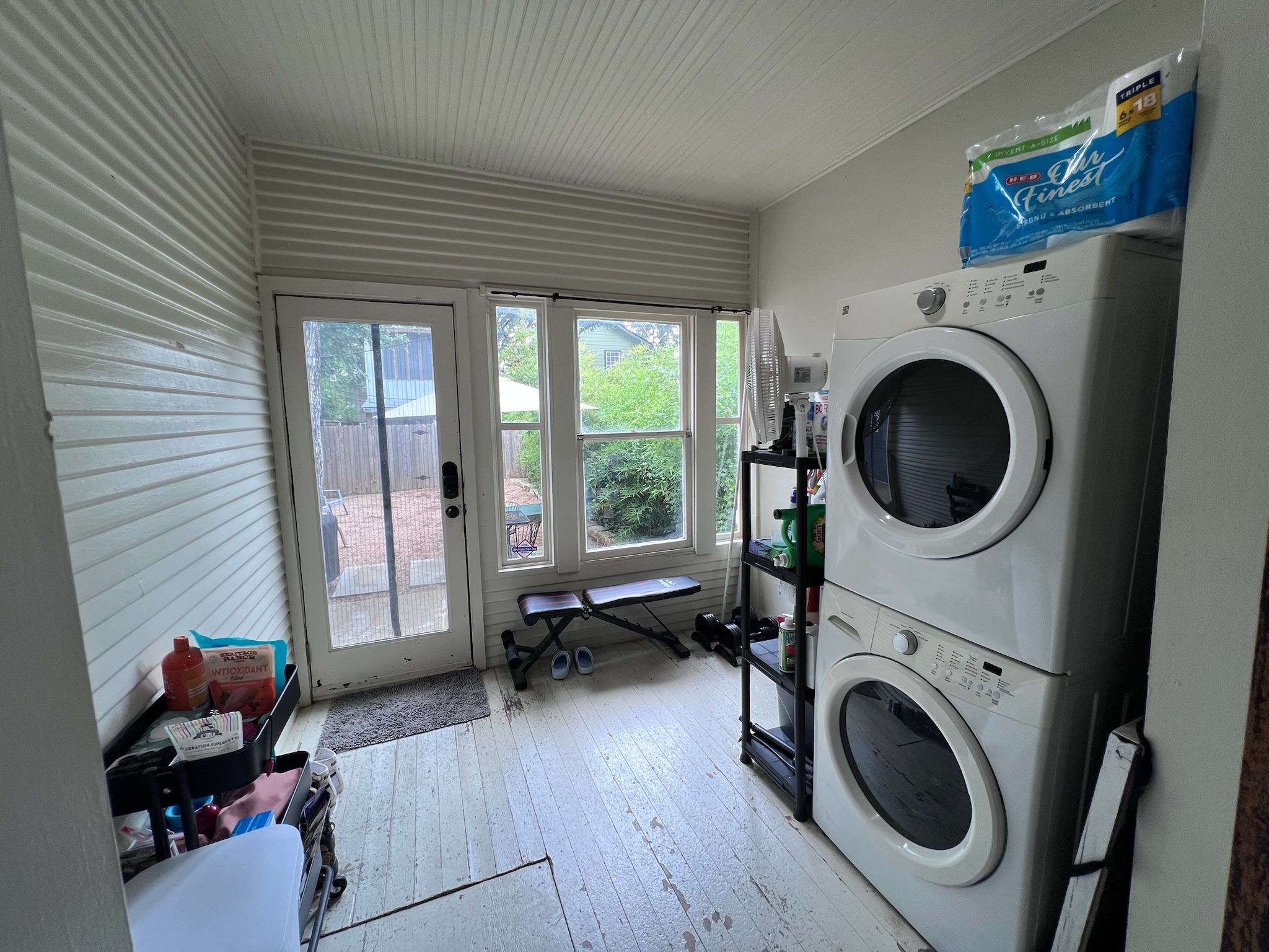 307 East 35th Street, Unit A Austin, TX 78705 - Photo 21 of 31 Functional laundry room offers a stacked washer and dryer, along with exterior access.