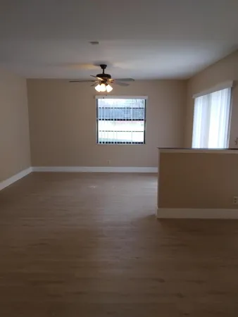 a view of an empty room with a window