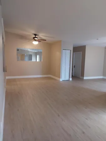 a view of empty room with windows