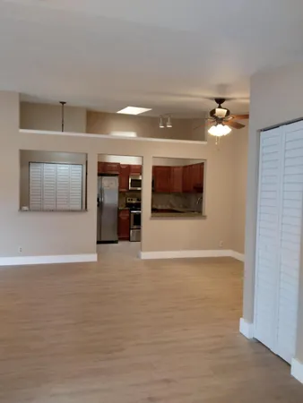 a view of a livingroom with a kitchen