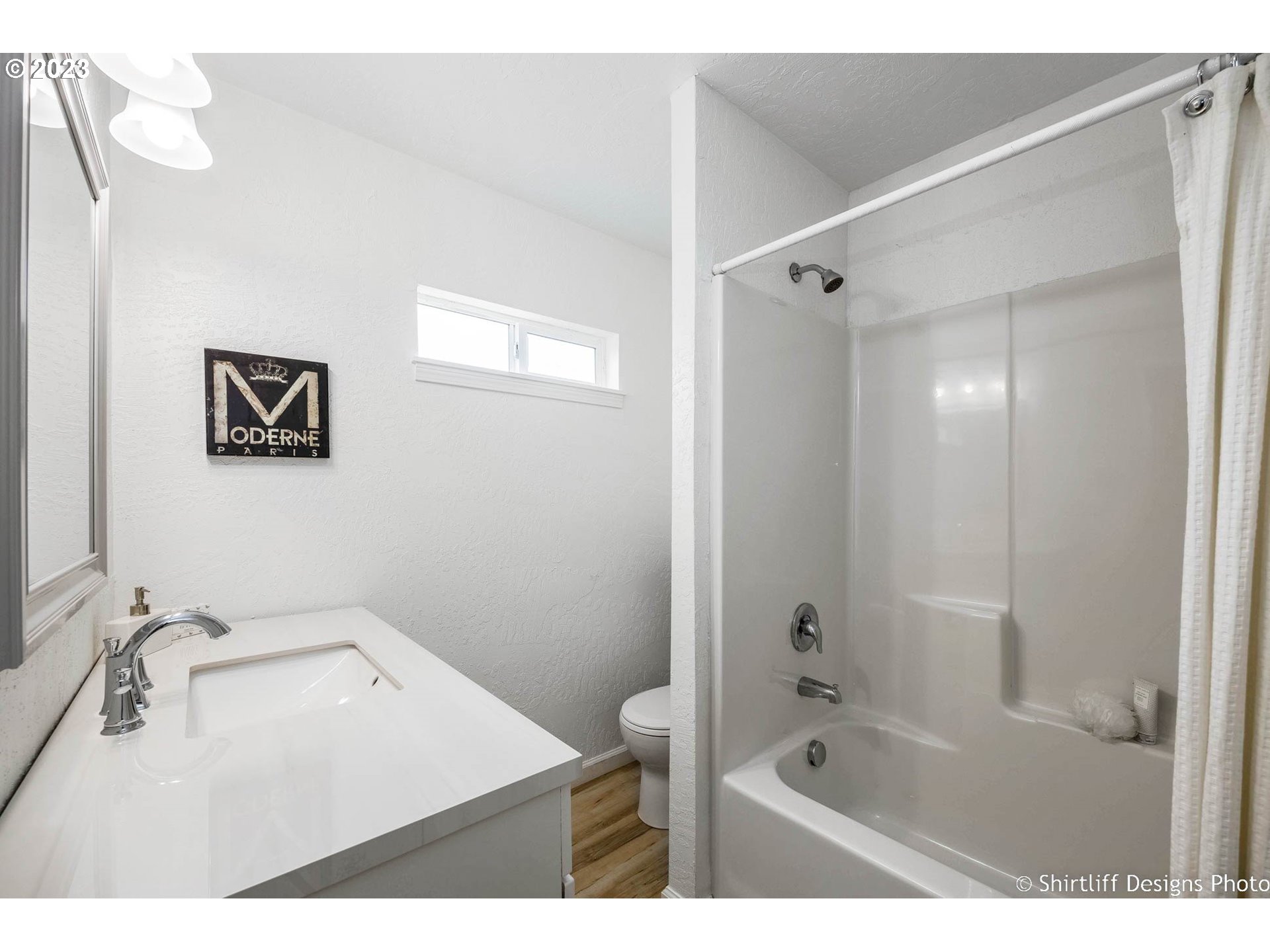 1446 E Street Springfield, OR 97477 - Photo 17 of 26 a bathroom with a tub sink vanity granite and shower