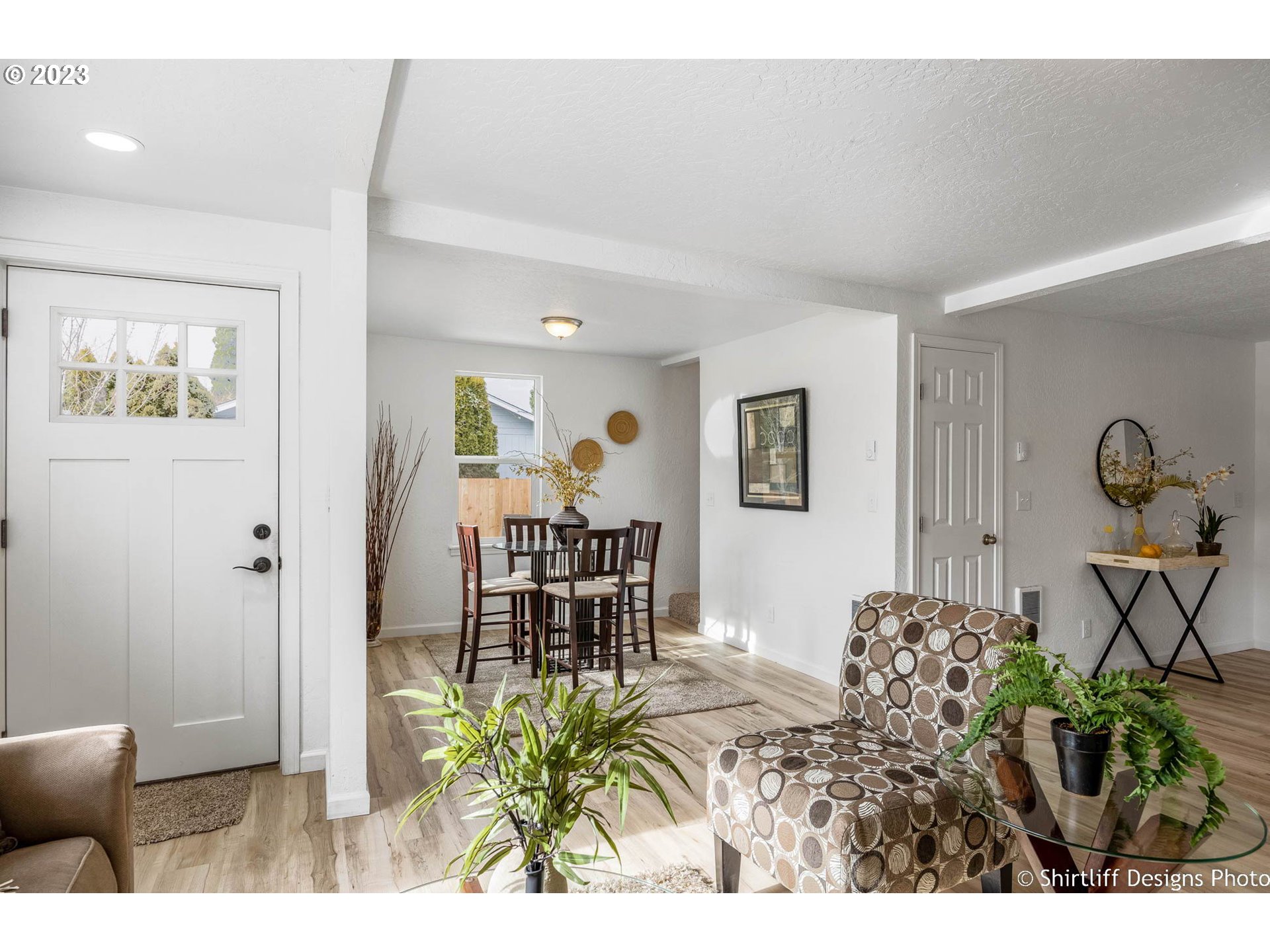 1446 E Street Springfield, OR 97477 - Photo 5 of 26 a view of a dining room with furniture and a potted plant