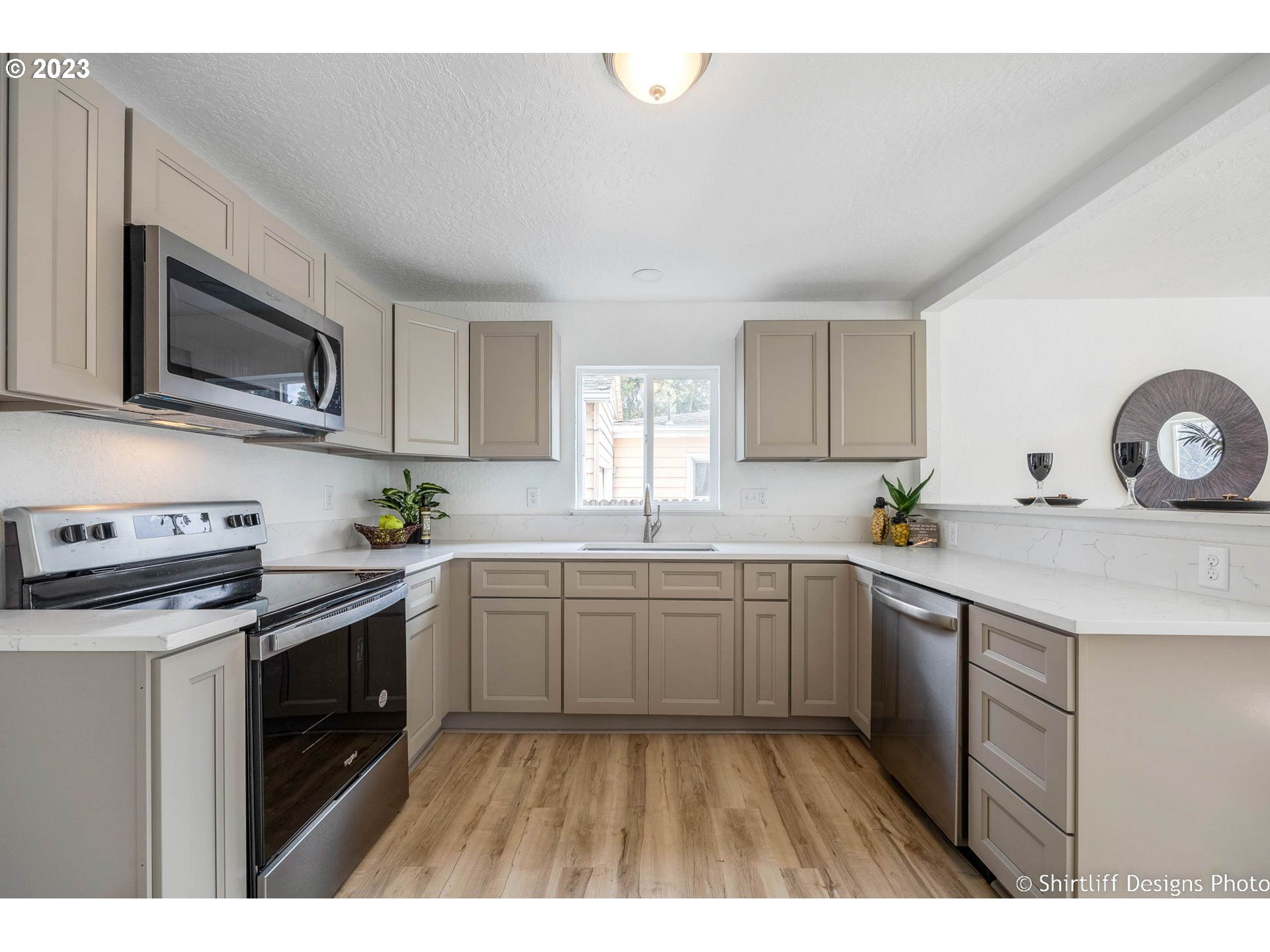 1446 E Street Springfield, OR 97477 - Photo 8 of 26 a kitchen with a sink stove and microwave