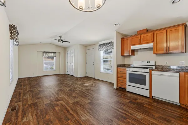 a view of a kitchen with stove and cabinets