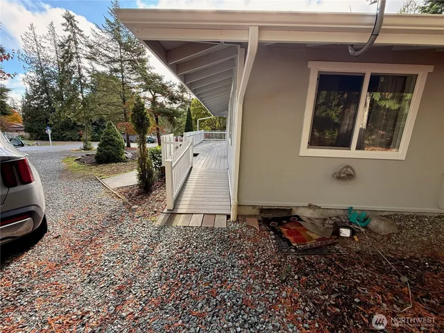 a backyard of a house with barbeque oven