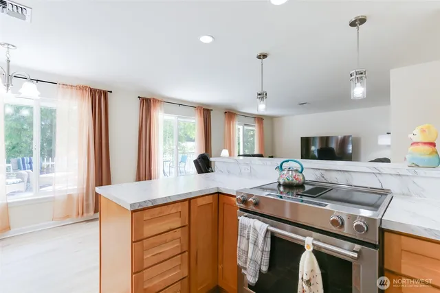 a kitchen with a stove and a sink