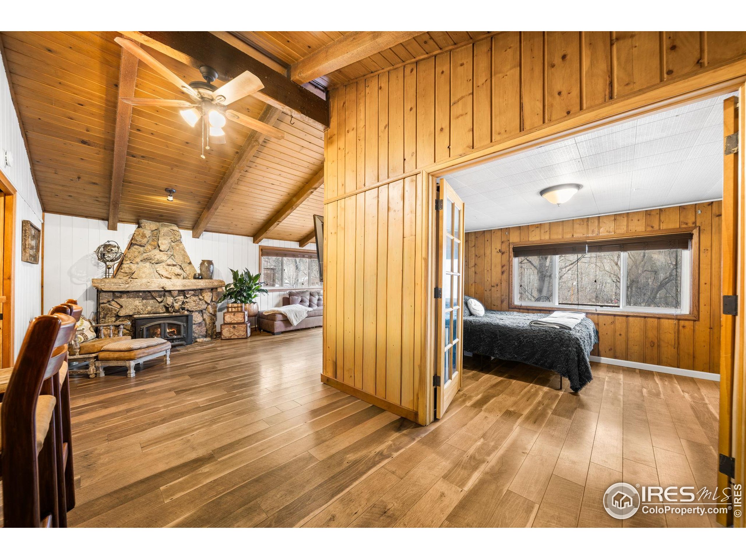 24 Tracy Trail Road Loveland, CO 80537 - Photo 16 of 34 a living room with furniture and a window