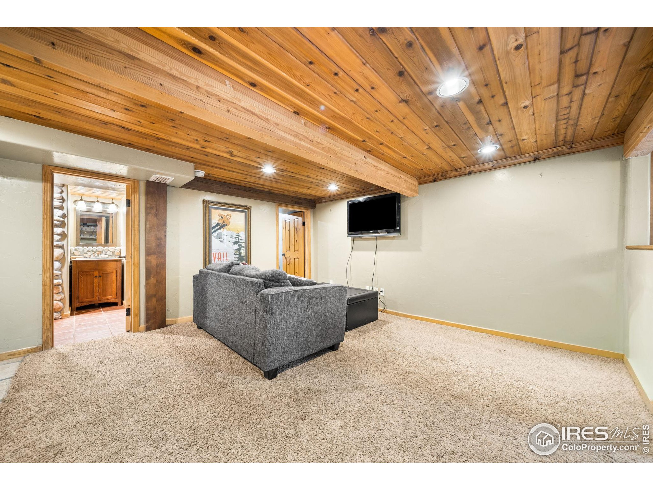 24 Tracy Trail Road Loveland, CO 80537 - Photo 23 of 34 a living room with furniture and a open kitchen