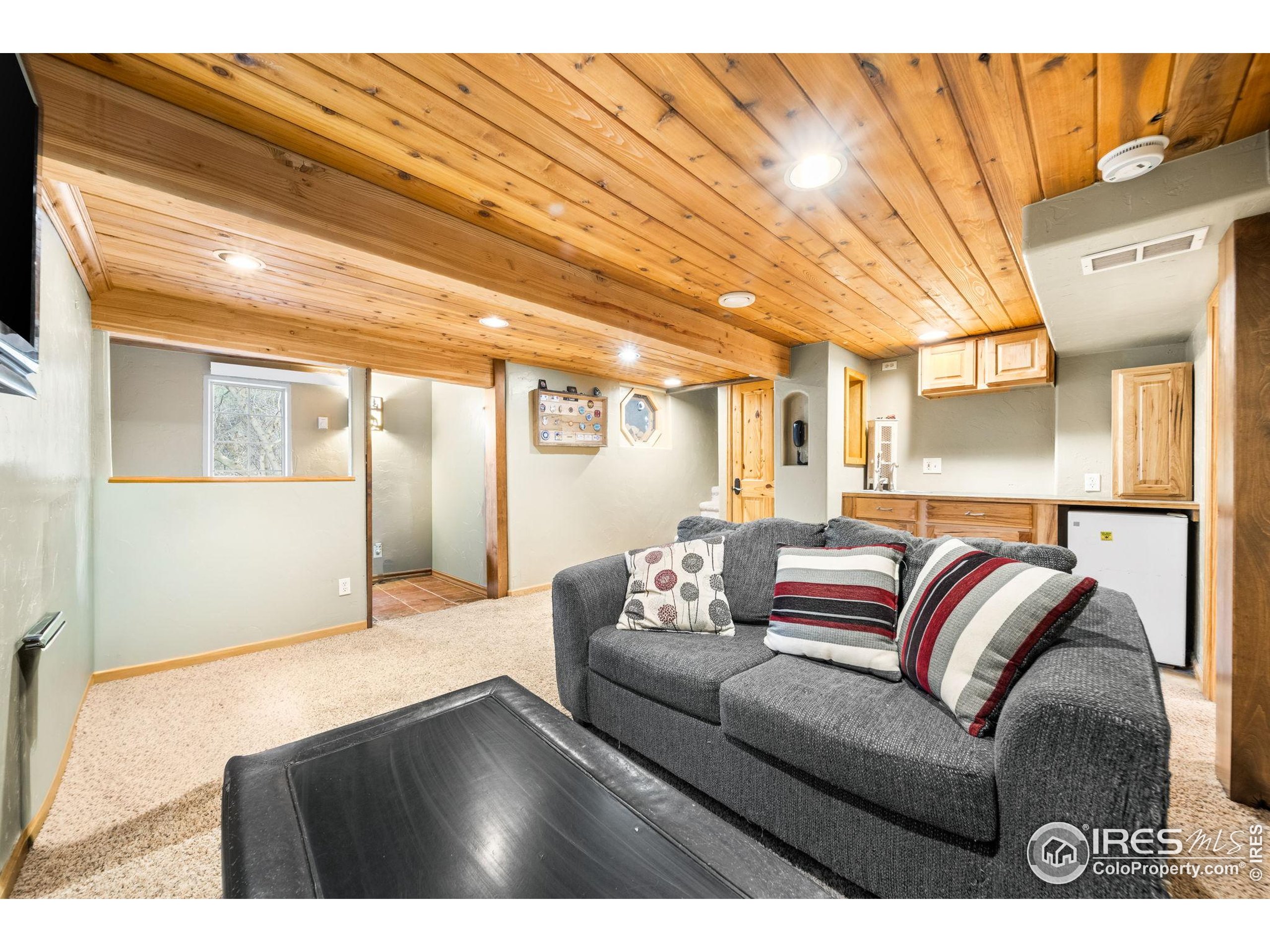 24 Tracy Trail Road Loveland, CO 80537 - Photo 24 of 34 a living room with a couch and a table
