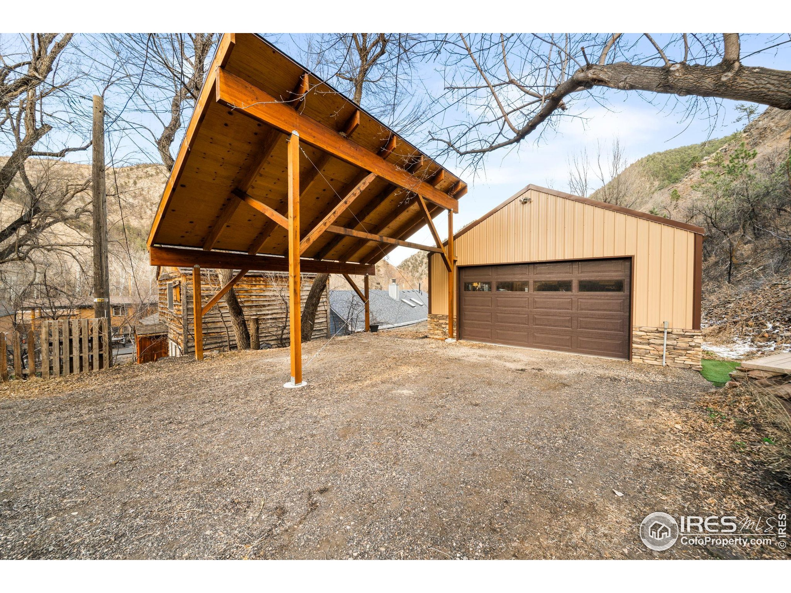 24 Tracy Trail Road Loveland, CO 80537 - Photo 3 of 34 a house with a outdoor space