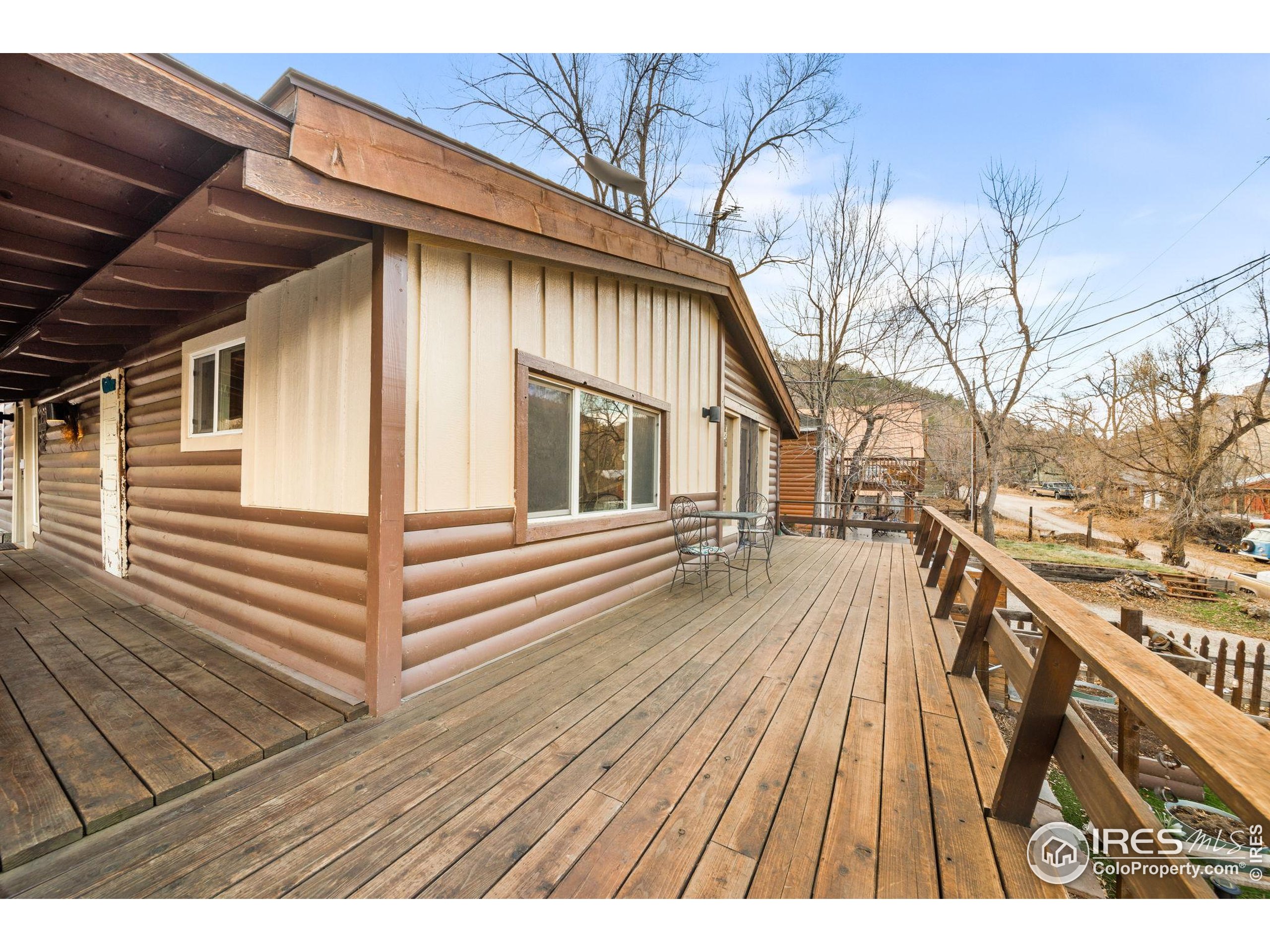 24 Tracy Trail Road Loveland, CO 80537 - Photo 6 of 34 a view of a wooden deck