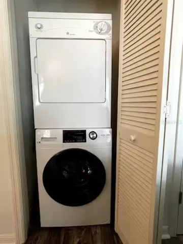 a close view of a utility room with dryer and washer