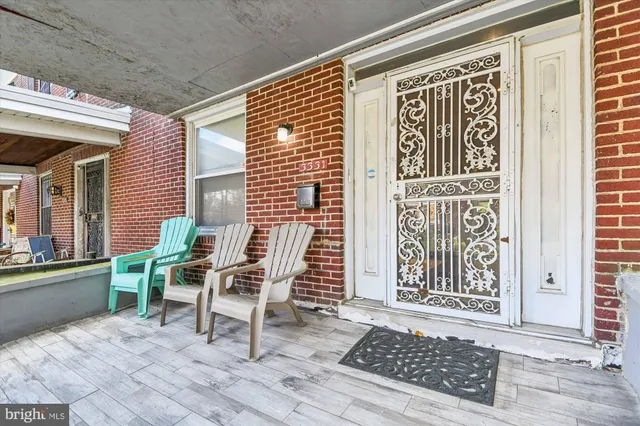 a chair and table sitting in front of a door