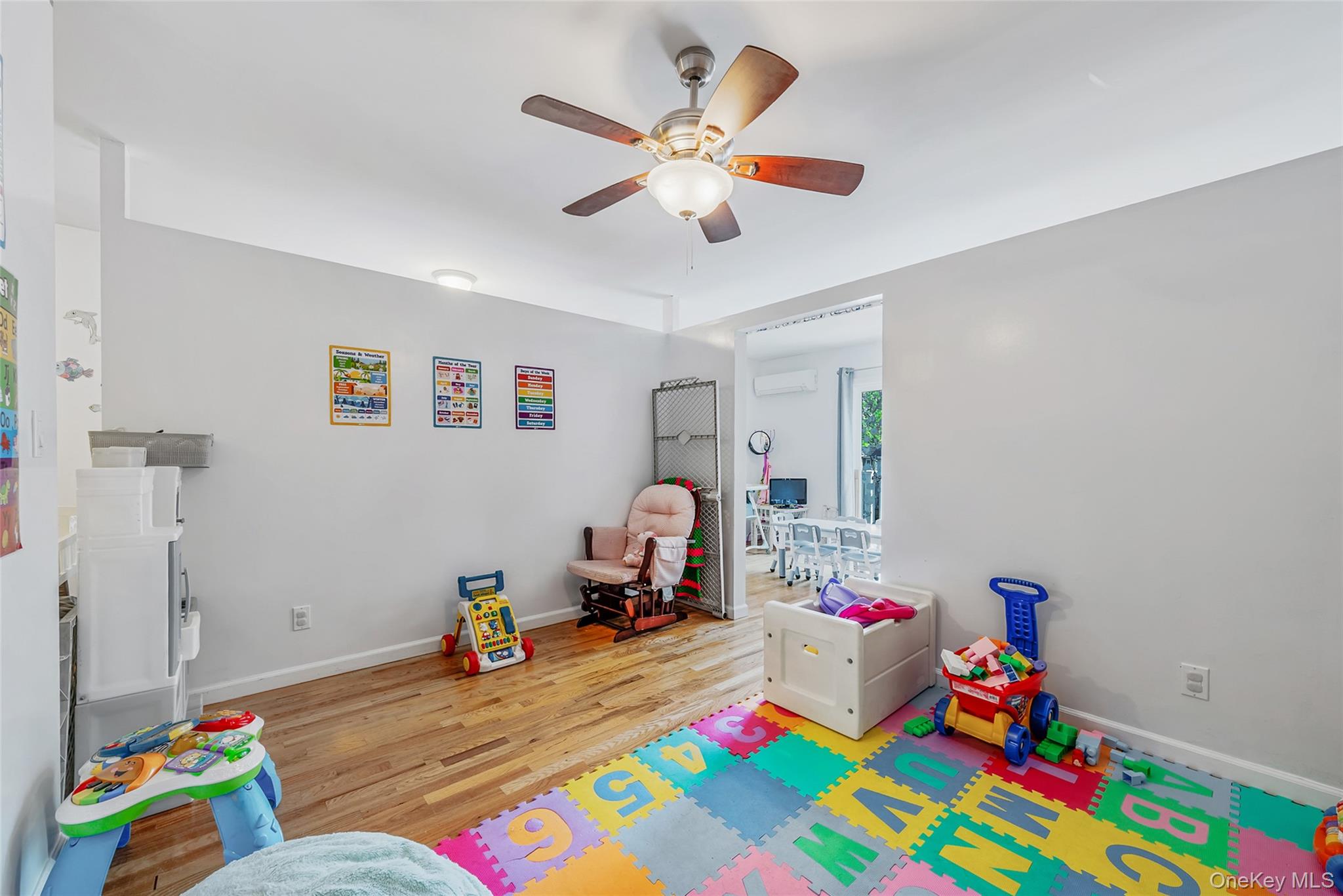 80 George Street Babylon, NY 11702 - Photo 26 of 41 a living room with baby crib furniture and a baby crib
