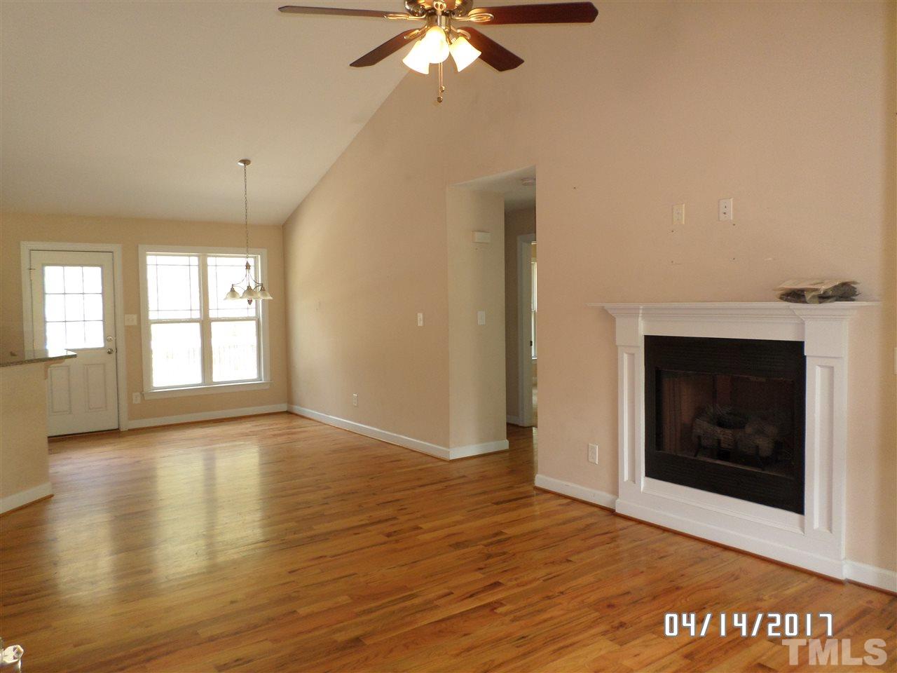 3993 Range Road Stem, NC 27581 - Photo 2 of 12 a view of an empty room with window and wooden floor