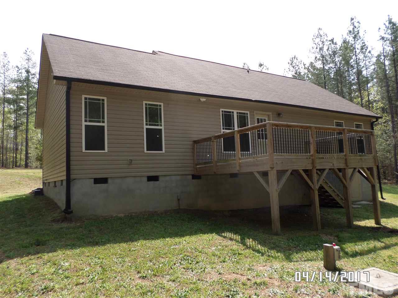 3993 Range Road Stem, NC 27581 - Photo 12 of 12 a front view of a house with garden
