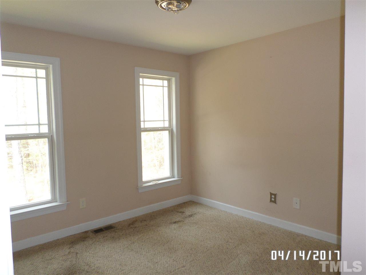 3993 Range Road Stem, NC 27581 - Photo 9 of 12 an empty room with windows