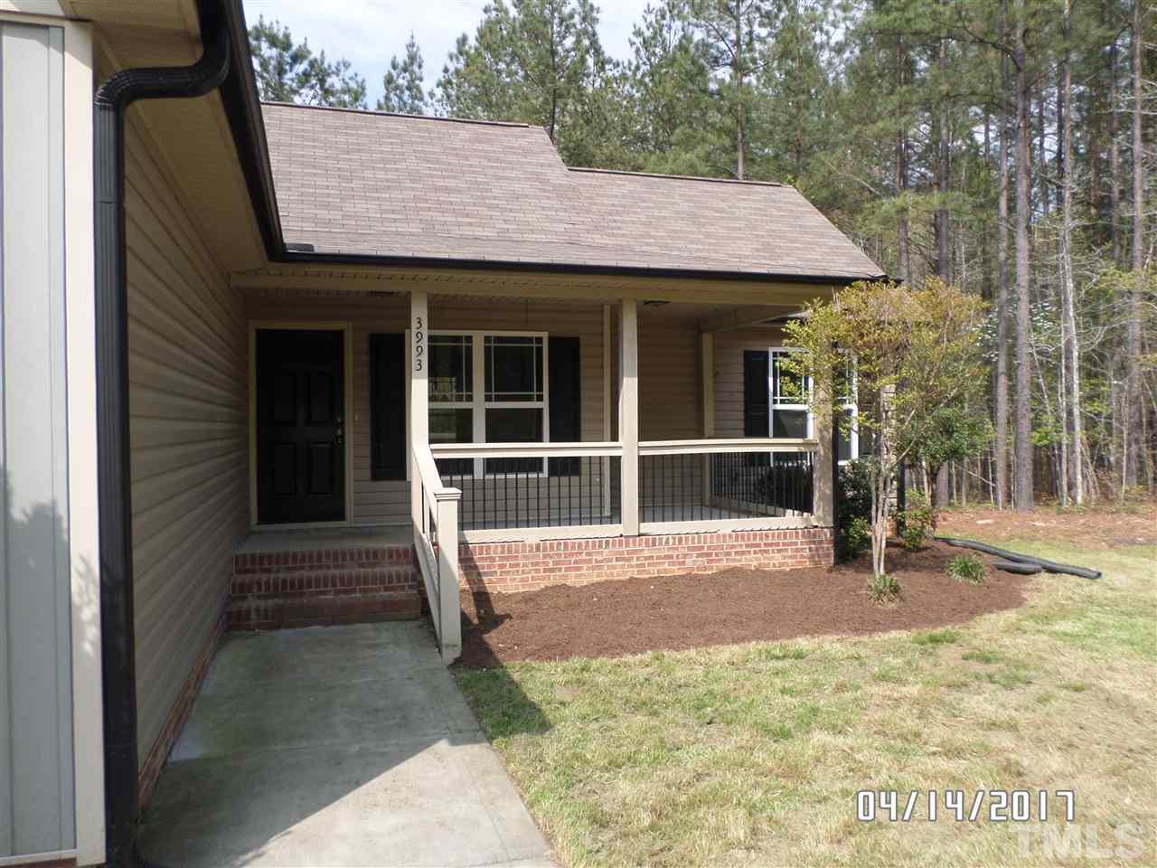 3993 Range Road Stem, NC 27581 - Photo 10 of 12 a house view with a garden space