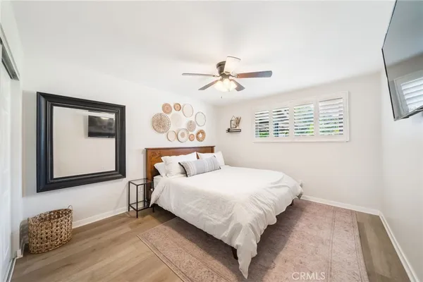 a bedroom with a large bed and a window