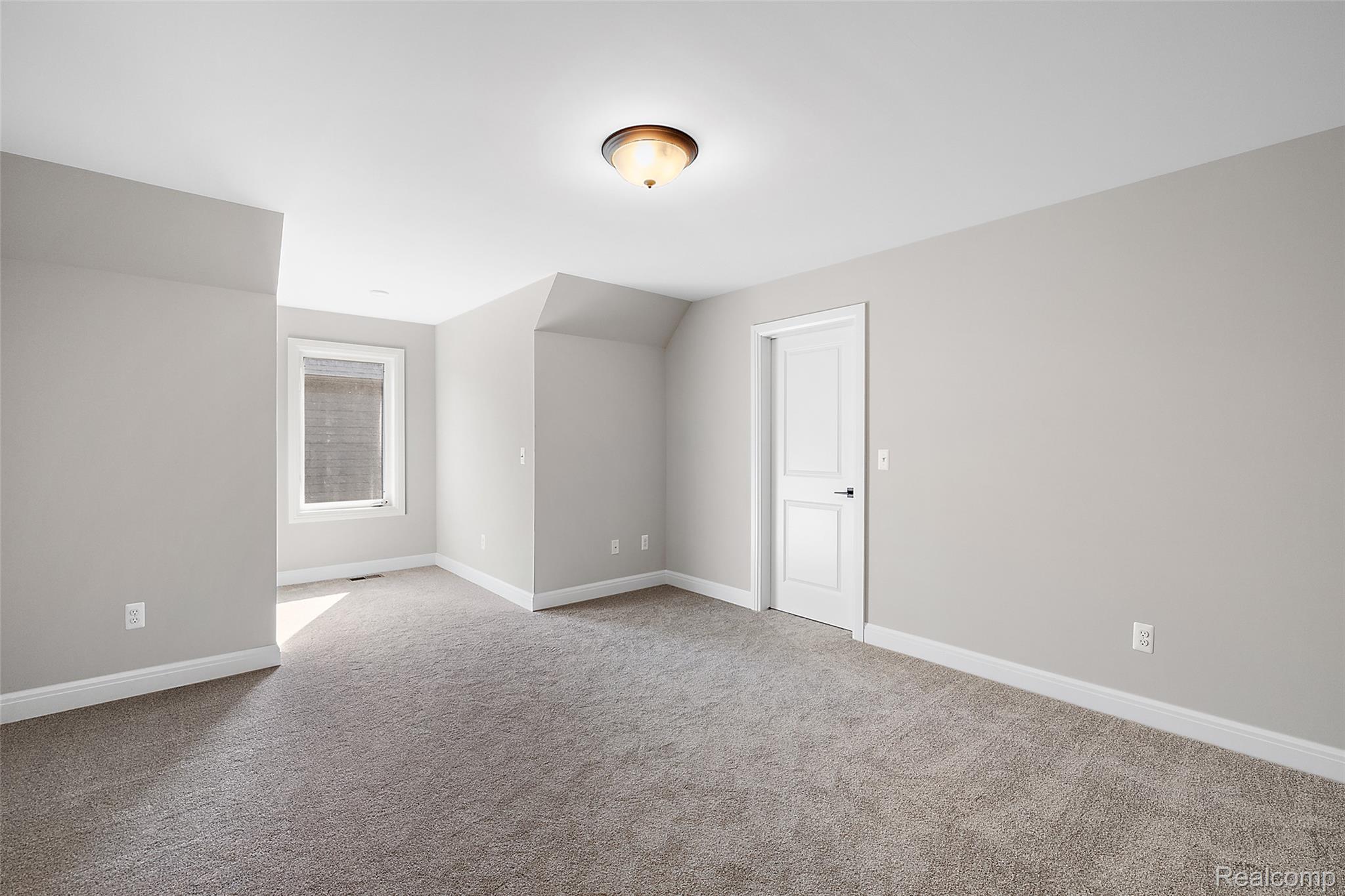 8267 Sandi Lane Romeo, MI 48065 - Photo 40 of 46 Neutral wall paint, plush carpet flooring, recessed window, paneled interior door, and a ceiling-mounted light fixture