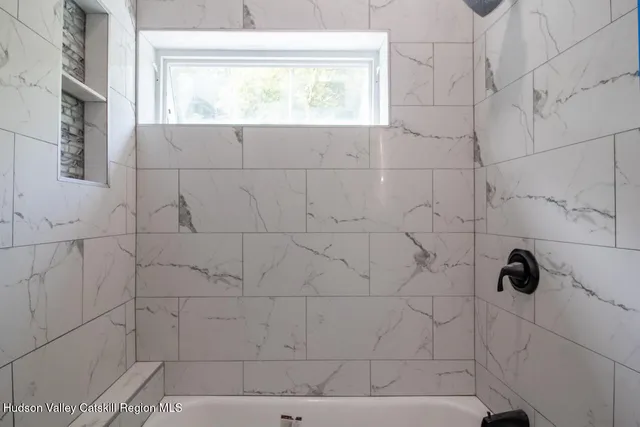 a close up of a bathtub in a bathroom