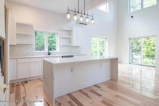 a view of hallway with furniture and window