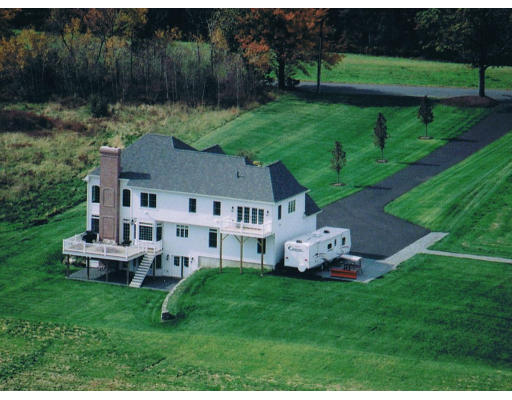 21 Davis Road Millbury, MA 01527 - Photo 2 of 12 a aerial view of a house with a yard table and chairs