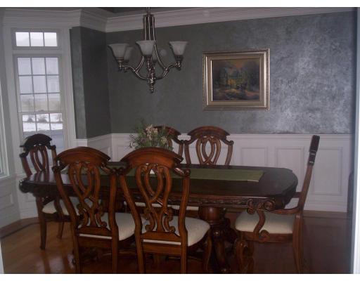 21 Davis Road Millbury, MA 01527 - Photo 6 of 12 a view of a dining room with furniture and chandelier