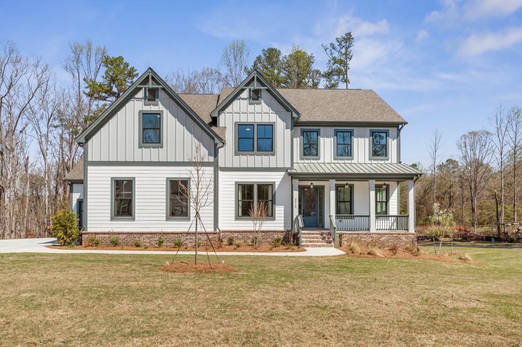 4510 Aiden Way Cumming, GA 30041 - Photo 1 of 53 a front view of a house with a yard