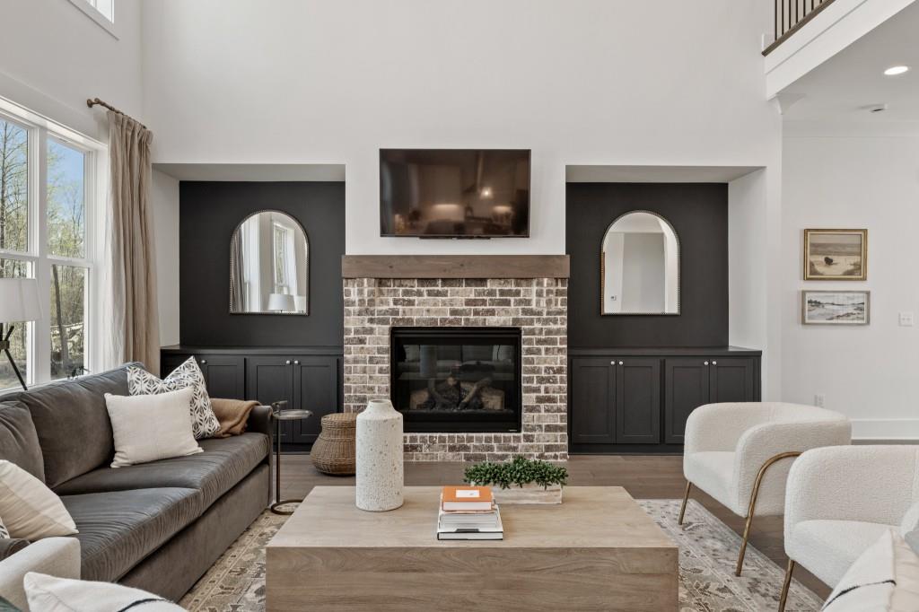 4510 Aiden Way Cumming, GA 30041 - Photo 12 of 53 a living room with furniture and a fireplace