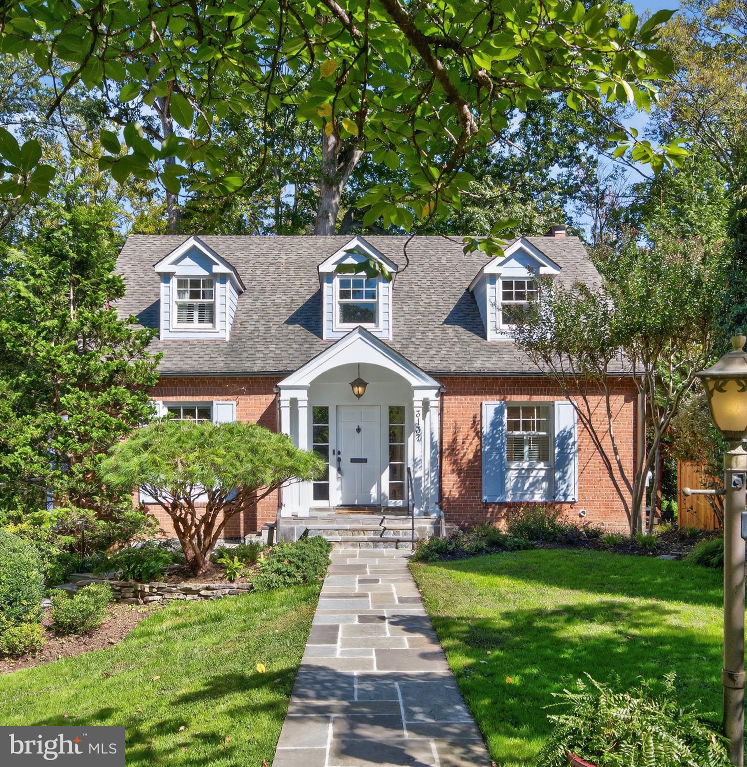 3137 Aberfoyle Place Northwest Washington, DC 20015 - Photo 1 of 85 a front view of a house with a garden