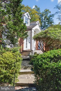 a front view of a house with yard