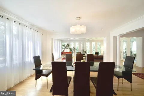 a kitchen with stainless steel appliances granite countertop a sink a stove and a wooden floors