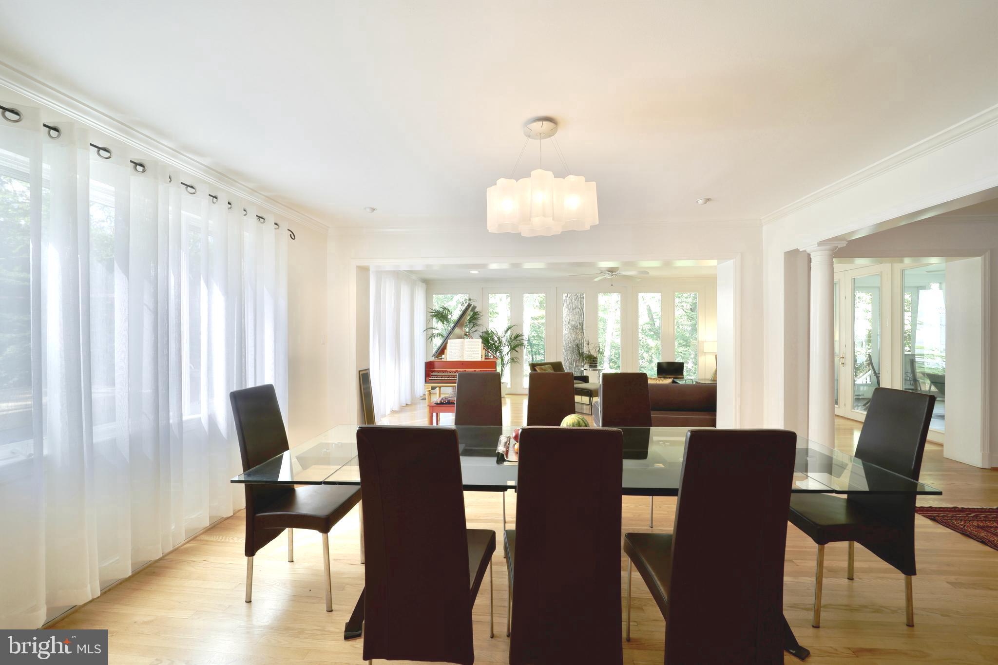 3137 Aberfoyle Place Northwest Washington, DC 20015 - Photo 22 of 85 a view of a dining room with furniture window and wooden floor