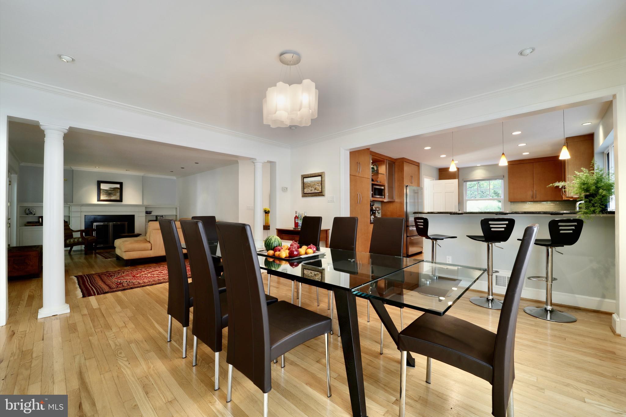 3137 Aberfoyle Place Northwest Washington, DC 20015 - Photo 23 of 85 a view of a dining room with furniture and wooden floor