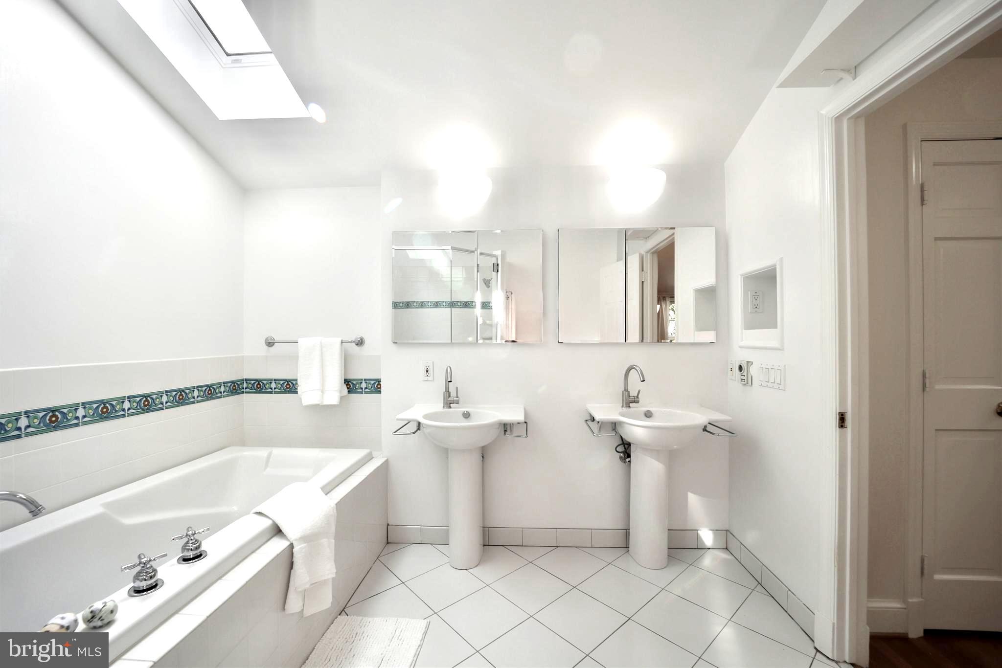 3137 Aberfoyle Place Northwest Washington, DC 20015 - Photo 49 of 85 a bathroom with a sink a toilet and bathtub